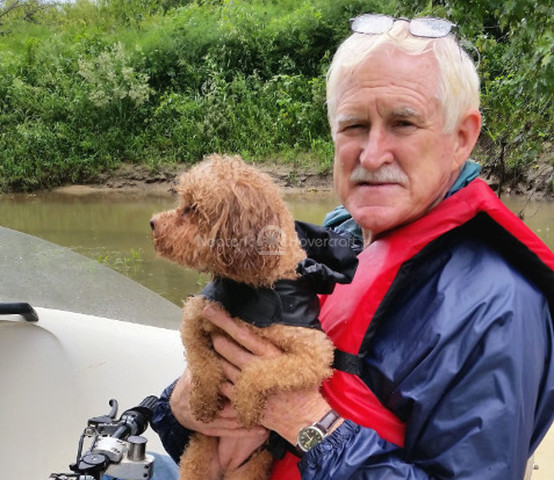 Image dog riding hovercraft Chris Fitzgerald Hovering puppy